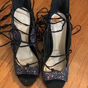 Cupid Size 8.5 Lace up the leg 5 inch open toe heels.